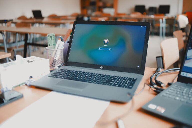 Laptops on a desk in a learning space