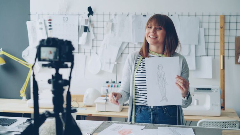 Creative professional filming a tutorial in a studio