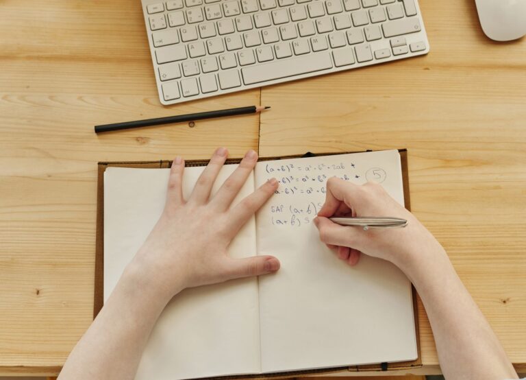 Person taking notes during an online session