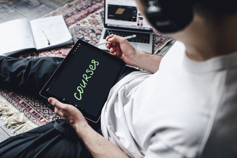 Person using a tablet with headphones on