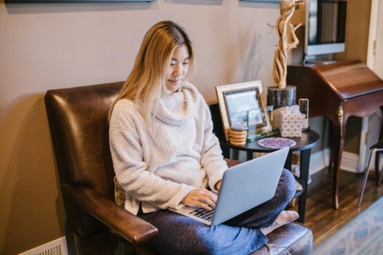 Woman working at a laptop in a home office