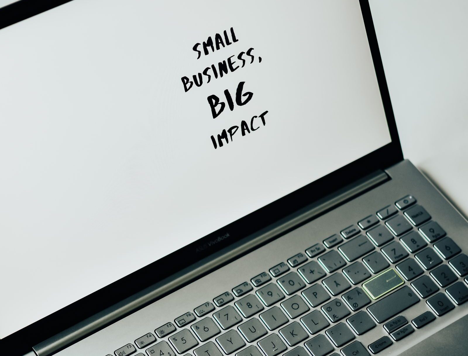Laptop screen reading Small Business Big Impact