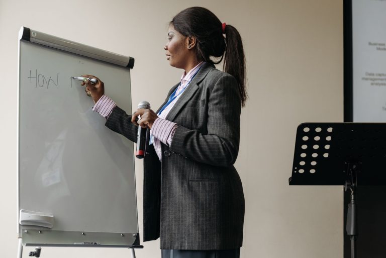 Presenter working at a whiteboard during a session
