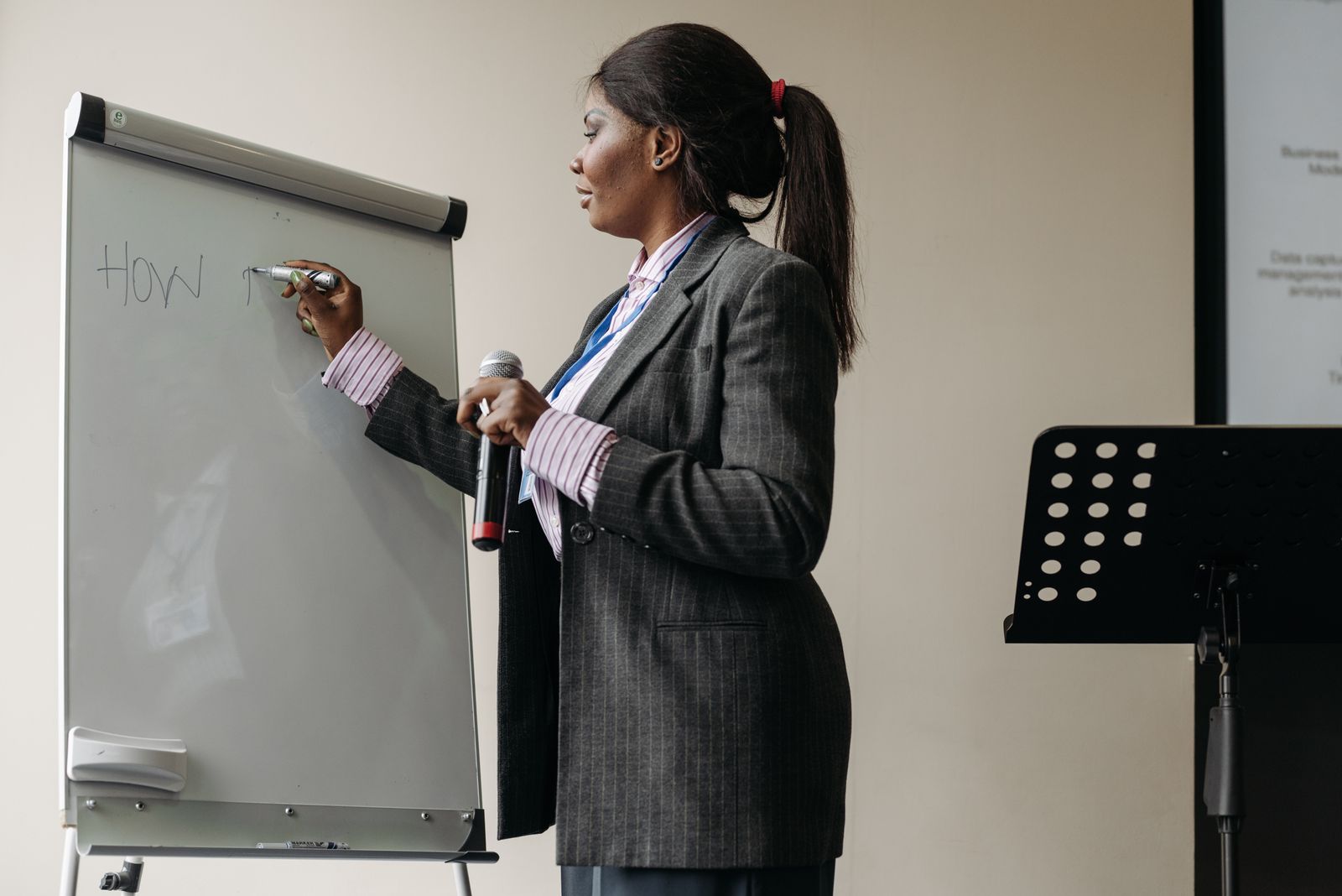 Presenter working at a whiteboard during a session