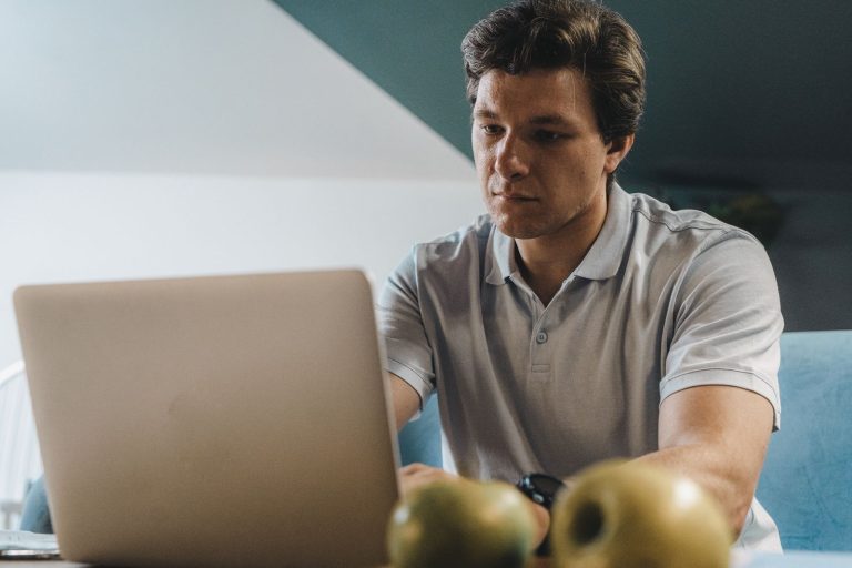 Freelancer working on a laptop at home
